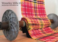 bright pink, black and yellow tartan cascades from the ceiling and pools over a huge spool with the words Waverley Mills 150+ celebrating a local textiles icon